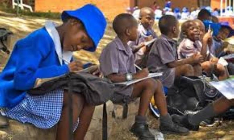 Government urges schools not to block BEAM learners despite arrears stretching back two years.