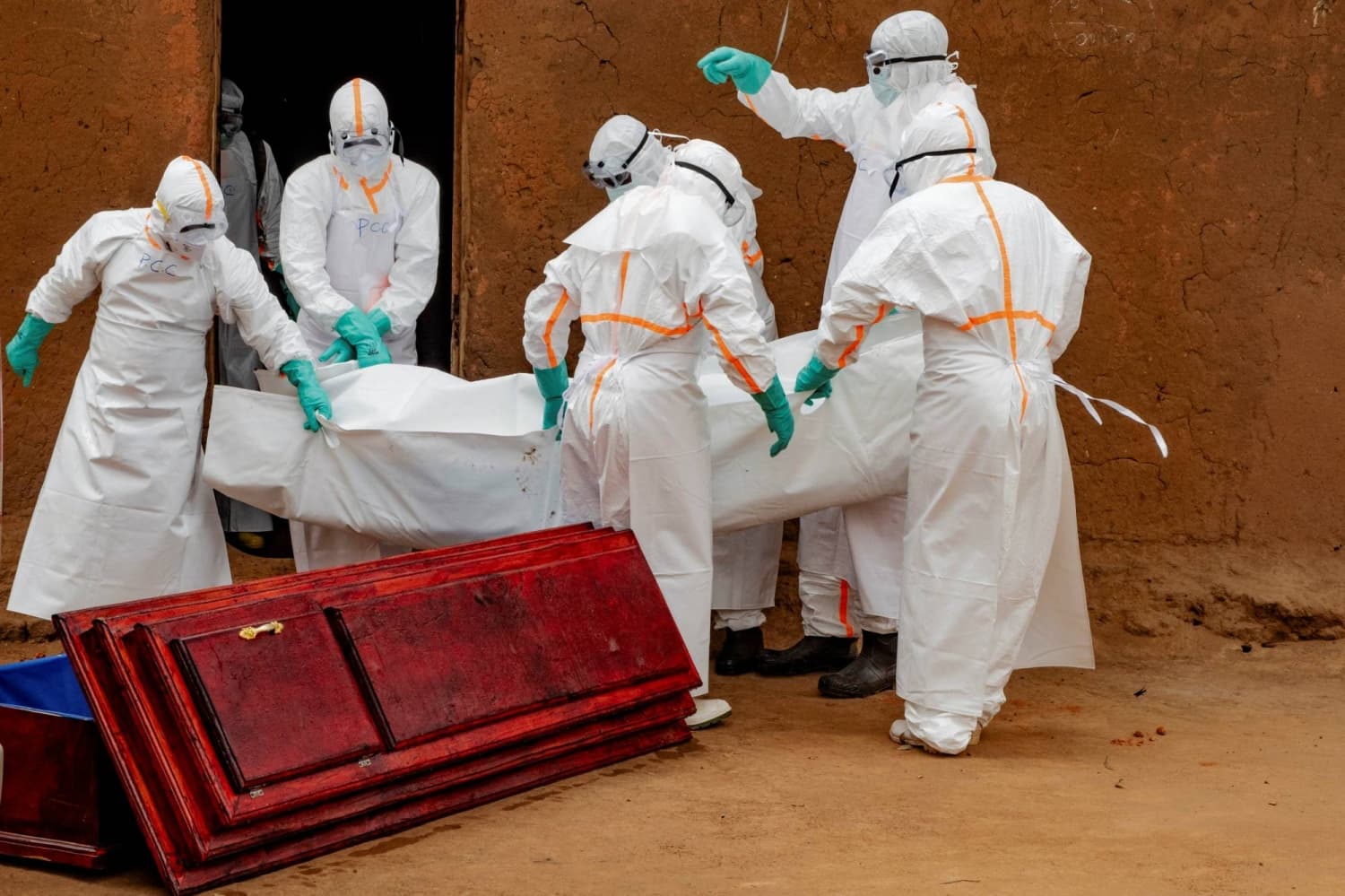 Health workers wearing protective clothing at an Ebola treatment centre in the Democratic Republic of Congo.