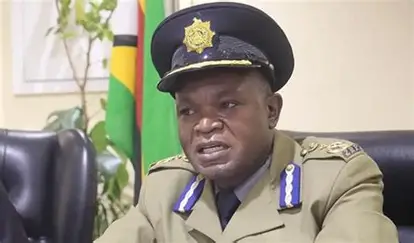 Police officers displaying recovered dagga during a drug bust.